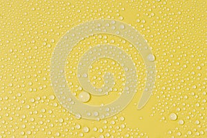 Close up of water drops on yellow tone background. Abstract Black and White