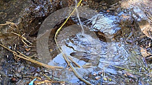 Close up of water gushing out of the pipe in the mountainous area of morocco, taberrant .