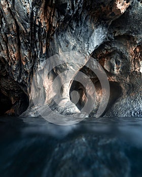 close up of the water of a lake in front of a mountain photo