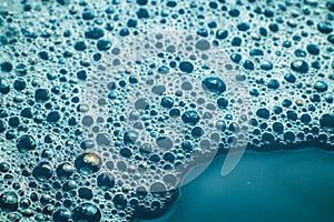 close up of water with soap bubbles photo