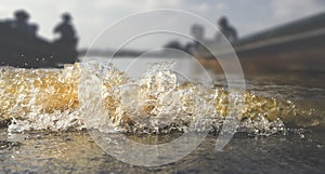 Close up of water wave splashing and foam bubble