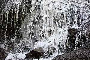 Close up of waterfall. Dynamic water flow. Waterscape background. Nature and environment concept. Pucak Manik waterfall Bali,