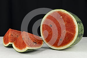 Close-up watermelon on concrete table and black color background