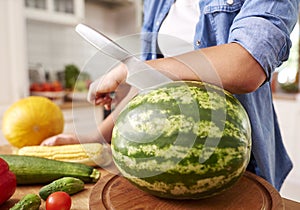 Watermelon and a knife stabbed in photo