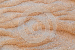 Close up of wave sand dunes pattern. Desert sand background or texture