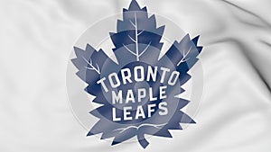 Close-up of waving flag with Toronto Maple Leafs NHL hockey team logo, 3D rendering