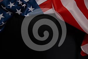 Close up of waving national usa american flag on black background with copy space