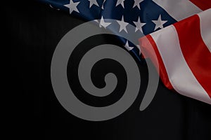 Close up of waving national usa american flag on black background with copy space