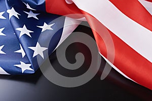 Close up of waving national usa american flag on a dark background with copy space. Concept of  4th of July or Memorial Day
