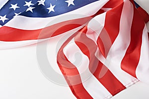 Close up of waving national usa american flag on a white background with copy space. Concept of  4th of July or Memorial Day