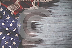 Close up of waving national usa american flag on wooden background