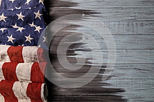 Close up of waving national usa american flag on wooden background