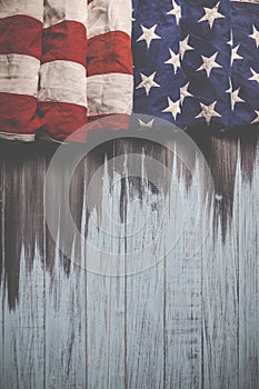 Close up of waving national usa american flag on wooden background