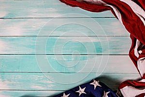 Close up of waving national usa american flag on wooden background