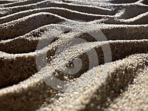 Close up of wavy sand background. Sea sand texture