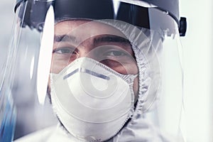 Close up of wear out medical engineer wearing face mask photo