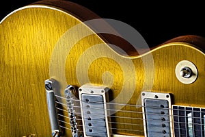 Close up of Wear on a Vintage Gold Electric Guitar Showing Age