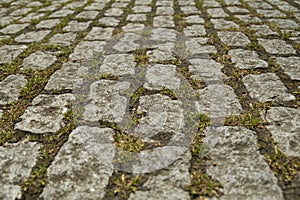 Close up of weathered old brick paving