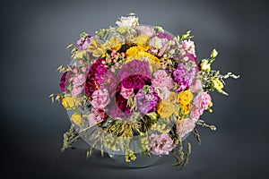 Close up wedding bouquet of flowers Isolated on a gray background. Delicate bouquet in pastel colors. Summer flowers