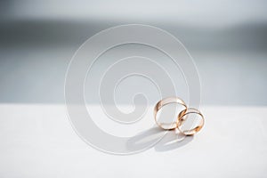 Close-up of wedding rings isolated on white background