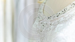 The close up wedding white fashion dress with detail of decorate