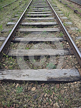 Close-up of railroad with wooden railroad sleepers