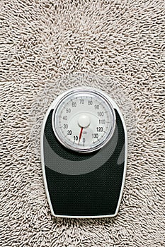 Close-up Weighing Scale in bathroom on stone ground.