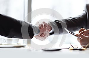 Close up.welcome handshake business partners. business concept