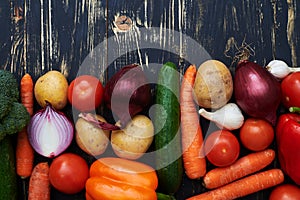 Close-up of well-arranged vegetables lying over wretched background photo