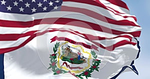 Close-up of West Virginia state flag waving in with the american flag