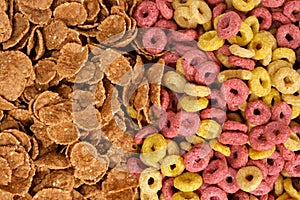 Close-up of wheat flakes and corn rings, top view.