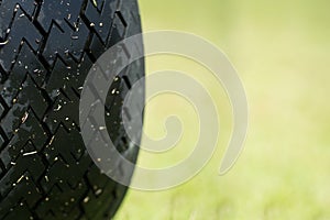 Close up wheel of Buggy car in a golf course.