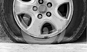 Close up wheel car and leaking tire
