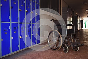 Close up of wheel chair by lockers