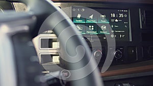 Close up of wheel and dashboard of a truck machine. Scene. View inside of a truck car interior.