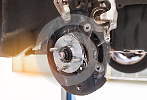 Close up wheel hub car with disc brake system on car maintenance suspension