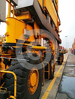 Close Up Wheel Rubber Tried Gantry Cranes RTG At Industrial Po