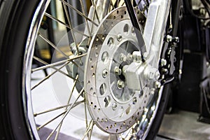 close up - wheel spokes and brake disc of a motorcycle