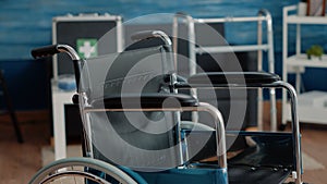 Close up of wheelchair in empty nursing home at clinic.