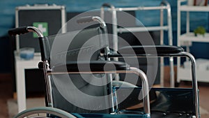 Close up of wheelchair in empty nursing home at clinic.