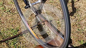 Close-up, the wheels of an old exercise bike, the bike rides in one place with the help of a special self-made fixture