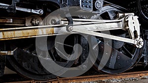 Close up wheels on stream powered locomotive.