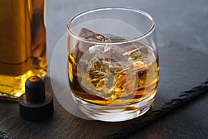 Close-up whiskey glass with cubes