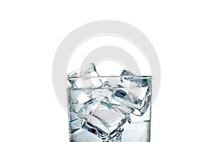 Close-up on a white background, a glass of water and ice cubes