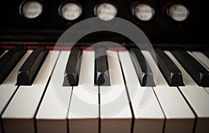 Close-up white and black keys of keyboard of old piano.