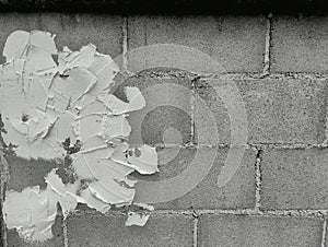 Close-up of White cement crack block wall and peeled paint caused by water and sunlight. Peel wall of White house paint with black