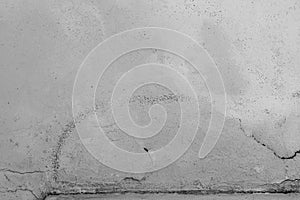 Close-up of White cement crack wall and peeled paint caused by water and sunlight. Peel wall of White house paint with black stain