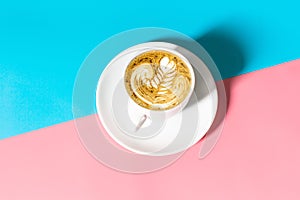 Close up white coffee cup with on blue and pink background, White cup of black coffee  on blue and pink background