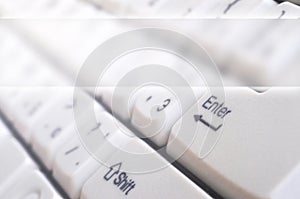 Close-up of the white computer classic keyboard with english and russian letters with copy space fiel