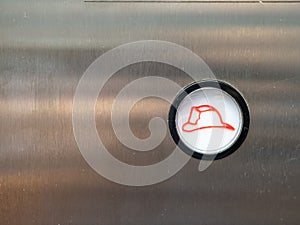 Close up of white firefighter fire emergency button on elevator